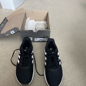 Adidas women’s Black and White Sneakers